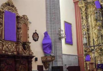 Cubren figuras femeninas en una iglesia de la CDMX para resaltar violencia contra mujeres